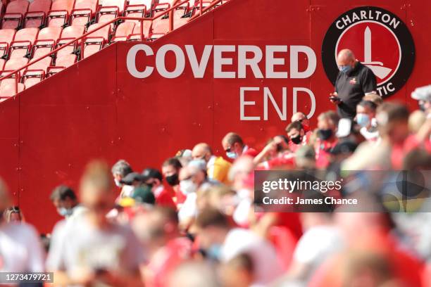 Fans are seen sitting in the covered end of the stadium during the Sky Bet League One match between Charlton Athletic and Doncaster Rovers at The...