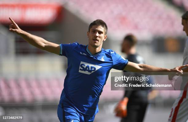 Andrej Kramaric of TSG 1899 Hoffenheim celebrates after scoring his team's first goal during the Bundesliga match between 1. FC Koeln and TSG...