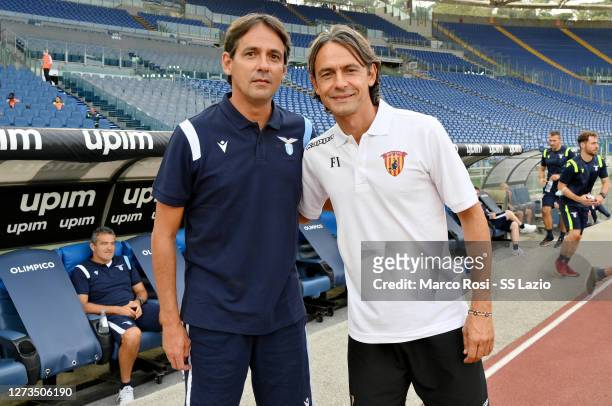 Lazio head coach Simone Inzaghi and Benevento head coach Filippo Inzaghi pose before the Friendly Match between SS Lazio and Benevento at Olimpico...