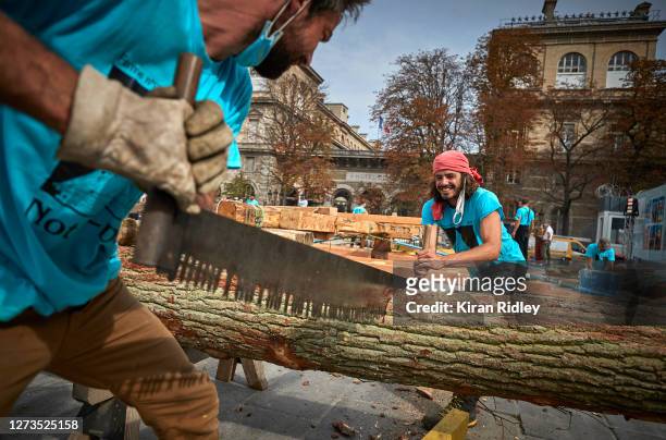 Members of the Charpentiers sans Frontièrs work to reconstruct one of the missing timber frames of Notre-Dame Cathedral that was destroyed by the...