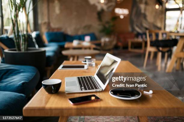 freelancer's office - laptop table stock pictures, royalty-free photos & images