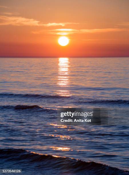 sunset on the baltic sea - sunset water stock pictures, royalty-free photos & images