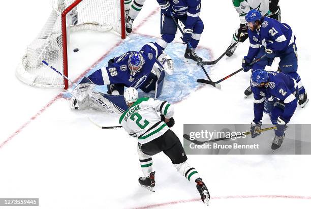 Jamie Oleksiak of the Dallas Stars scores a goal past Andrei Vasilevskiy of the Tampa Bay Lightning during the second period in Game One of the 2020...