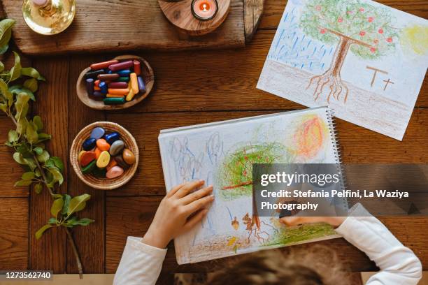 child learning to write the letter t as tree - child drawing job stock pictures, royalty-free photos & images