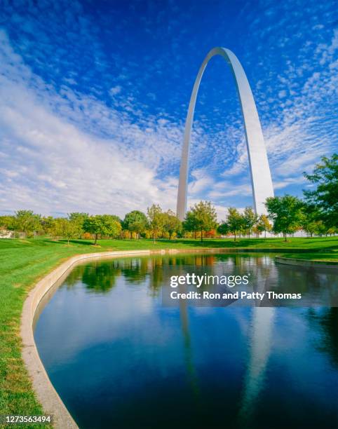 the gateway arch is surrounded by the gateway arch national park - missouri imagens e fotografias de stock