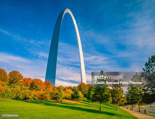 the gateway arch is surrounded by the gateway arch national park - missouri stock pictures, royalty-free photos & images