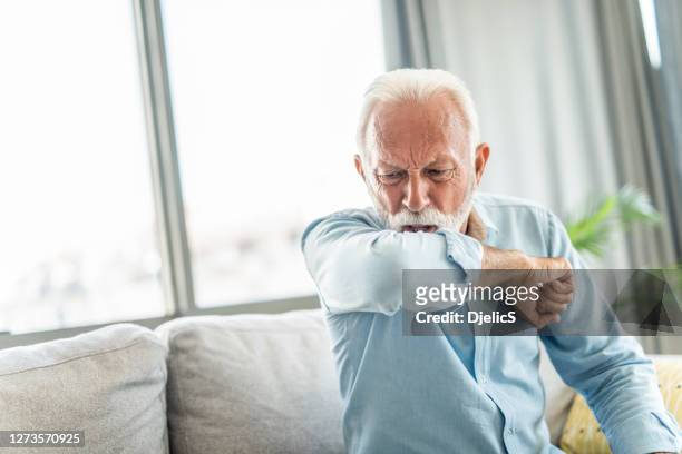 senior man coughing. - respiratory disease stock pictures, royalty-free photos & images