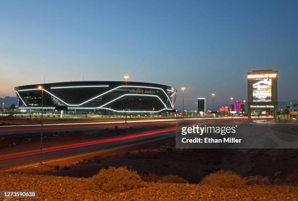 An exterior view shows Allegiant Stadium, the USD 2 billion 000-seat home of the Las Vegas Raiders, west of a marquee at Mandalay Bay Resort and...