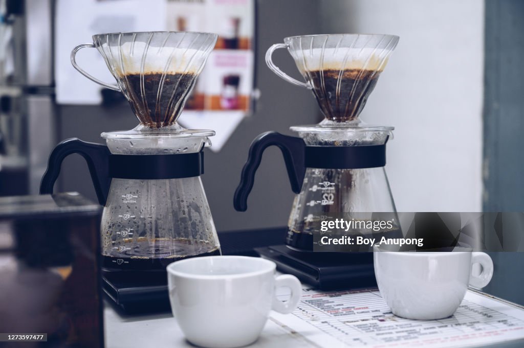 Sei of filter coffee being brewed in coffee shop.