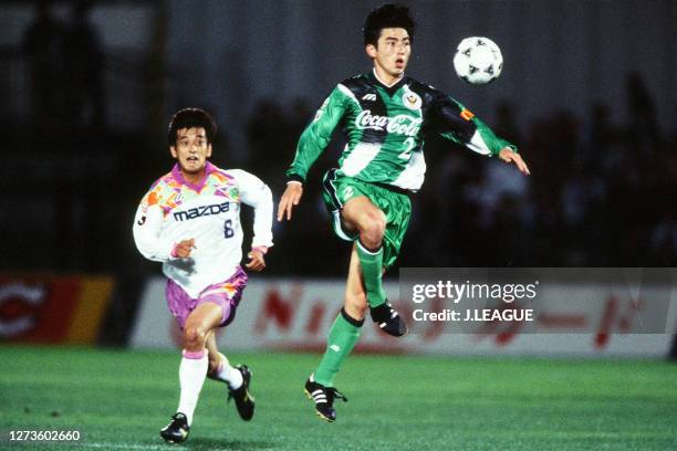 Shigetoshi Hasegawa of Verdy Kawasaki controls the ball under pressure of Takashi Onishi of Sanfrecce Hiroshima during the J.League Suntory Series...