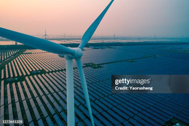 industrial landscape with different energy resources. sustainable development.net zero - turbina a vento - fotografias e filmes do acervo