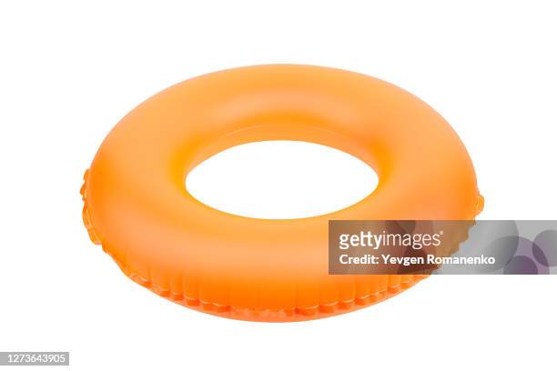 orange inflatable ring isolated on white background - rubber ring stock-fotos und bilder