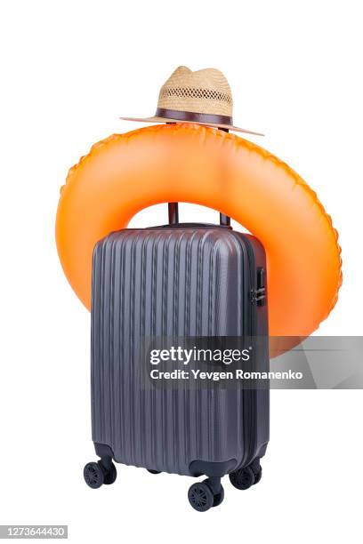 suitcase with swim ring and hat - yellow suitcase stock pictures, royalty-free photos & images