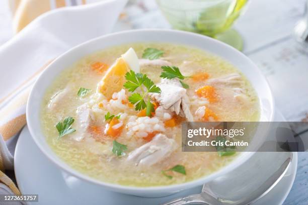 chicken soup with rice - chicken soup stock pictures, royalty-free photos & images