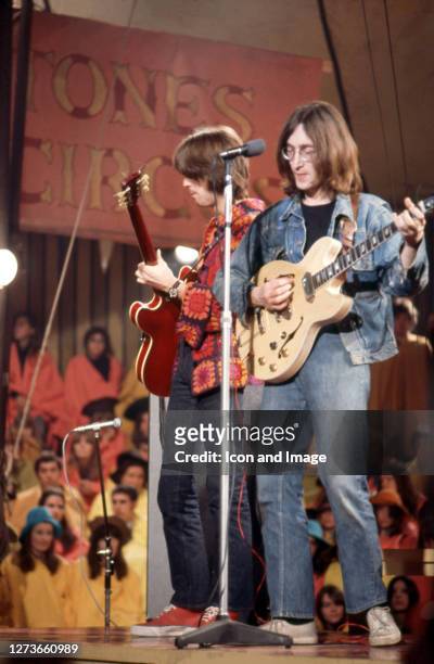 Eric Clapton, the English rock and blues guitarist, singer, and songwriter, and John Lennon , the English singer, songwriter, peace activist and...