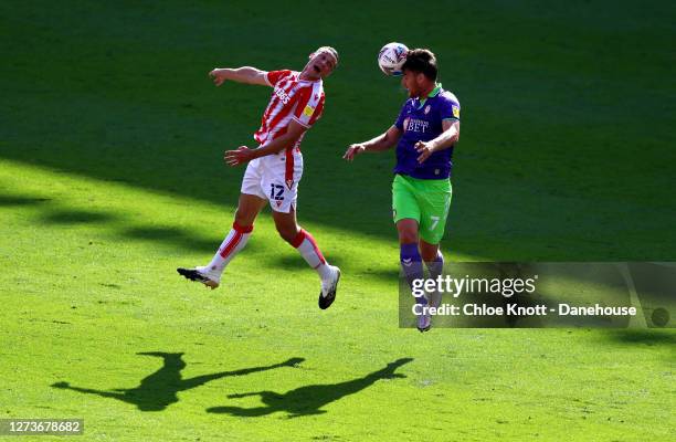 James Chester of Stoke City and Chris Martin of Bristol City in action during the Sky Bet Championship match between Stoke City and Bristol City at...