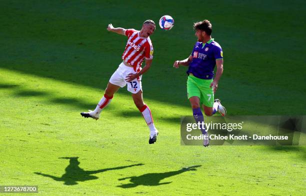 James Chester of Stoke City and Chris Martin of Bristol City in action during the Sky Bet Championship match between Stoke City and Bristol City at...