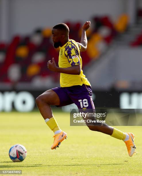 Isaac Mbenza of Huddersfield in action during the Sky Bet Championship match between Brentford and Huddersfield Town at Brentford Community Stadium...