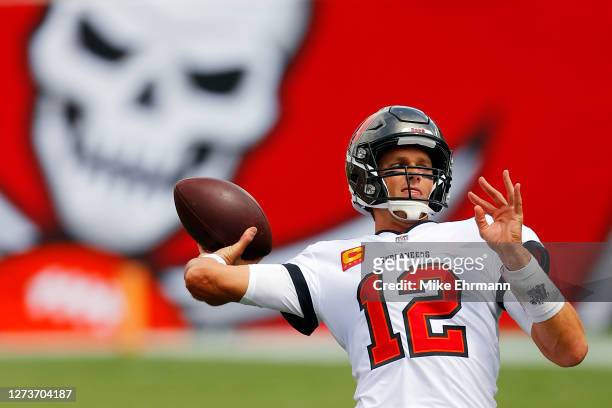 Tom Brady of the Tampa Bay Buccaneers warms up before the game against the Carolina Panthers at Raymond James Stadium on September 20, 2020 in Tampa,...