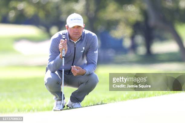 Lucas Glover of the United States lines up a putt on the first green during the final round of the 120th U.S. Open Championship on September 20, 2020...