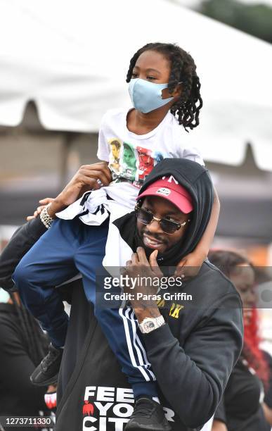 Host 2 Chainz and his son Halo Epps attend the Feed Your City Challenge on September 19, 2020 in Atlanta, Georgia. Feed Your City Challenge provided...