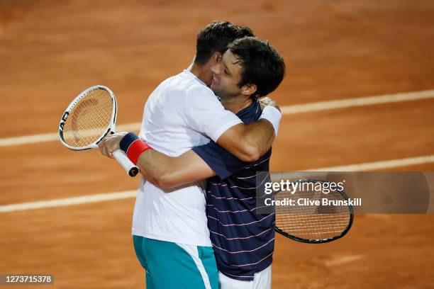 Marcel Granollers of Spain and playing partner Horacio Zeballos of Argentina celebrate match point in their men's doubles final against Jeremy Chardy...