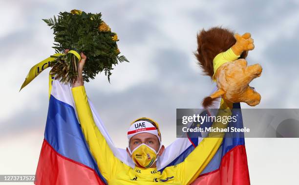 Podium / Tadej Pogacar of Slovenia and UAE Team Emirates Yellow Leader Jersey / Celebration / Mascot / Flowers / Mask / Covid safety measures /...