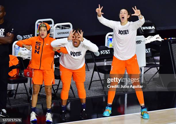 Natisha Hiedeman, Kaleena Mosqueda-Lewis, and Theresa Plaisance of the Connecticut Sun react after Jasmine Thomas scored on a three-point basket...