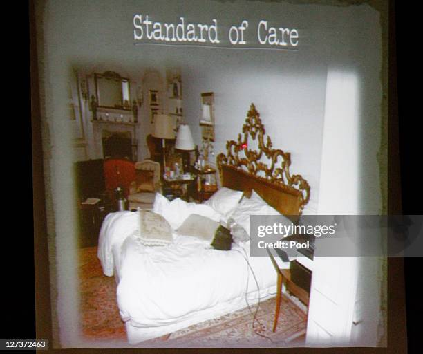 Slide of the bed where Michael Jackson died is shown during the prosecution's opening arguments in the involuntary manslaughter trial of Conrad...