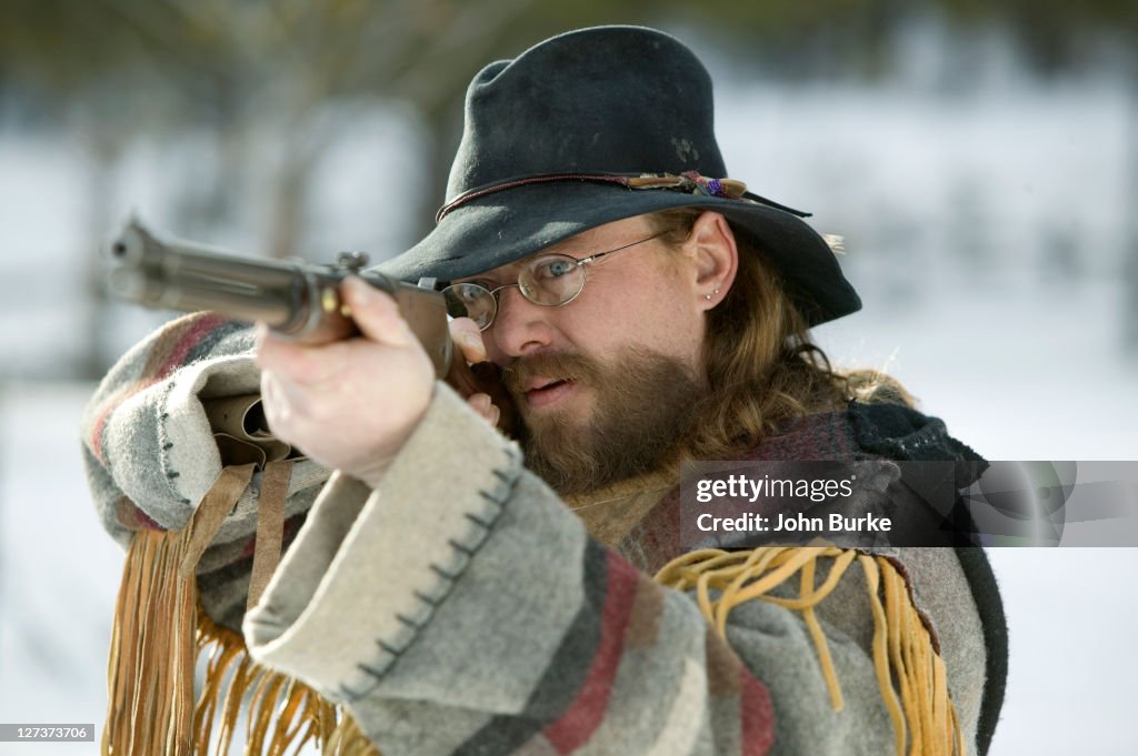 Hunter in traditional native American outfit