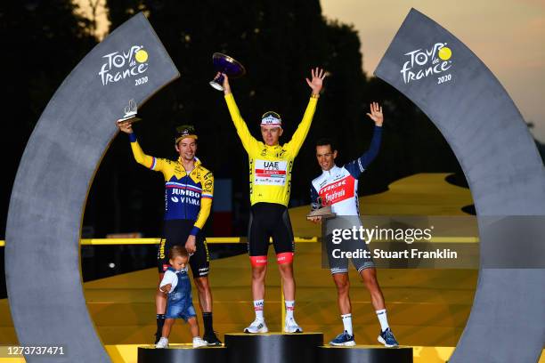 Podium / Primoz Roglic of Slovenia and Team Jumbo - Visma with his son Levom / Tadej Pogacar of Slovenia and UAE Team Emirates Yellow Leader Jersey /...