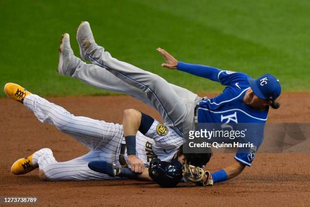 Christian Yelich of the Milwaukee Brewers is tagged out in the first inning against Nicky Lopez of the Kansas City Royals at Miller Park on September...