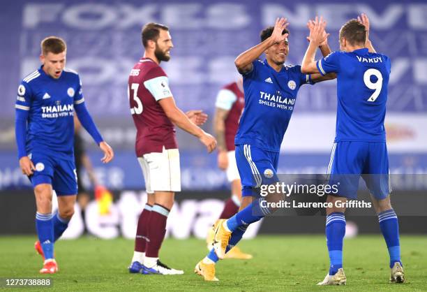 James Justin of Leicester City celebrates with teammate Jamie Vardy of Leicester City after scoring his team's third goal during the Premier League...