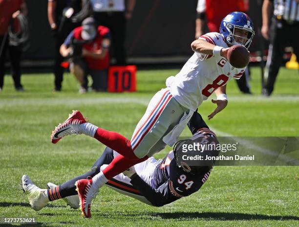 Daniel Jones of the New York Giants gets off a pass as he is hit by Robert Quinn of the Chicago Bears at Soldier Field on September 20, 2020 in...