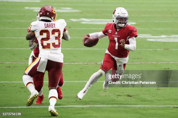 Quarterback Kyler Murray of the Arizona Cardinals runs with the football en route to scoring a 14 yard rushing touchdown against the Washington...
