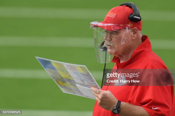 Head coach Andy Reid of the Kansas City Chiefs wears a face shield as he looks on from the sideline against the Los Angeles Chargers during the third...