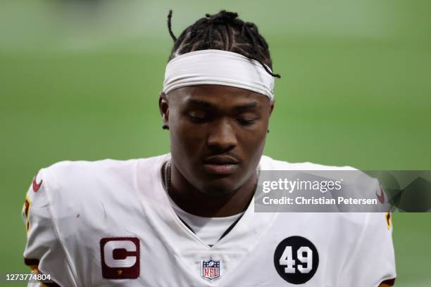 Quarterback Dwayne Haskins of the Washington Football Team walks off the field following the NFL game against the Arizona Cardinals at State Farm...