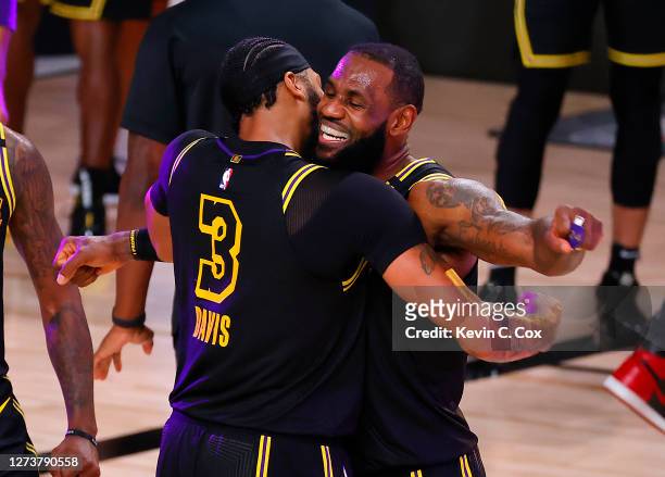 LeBron James of the Los Angeles Lakers celebrates with Anthony Davis of the Los Angeles Lakers after shooting a three point basket to win the game...