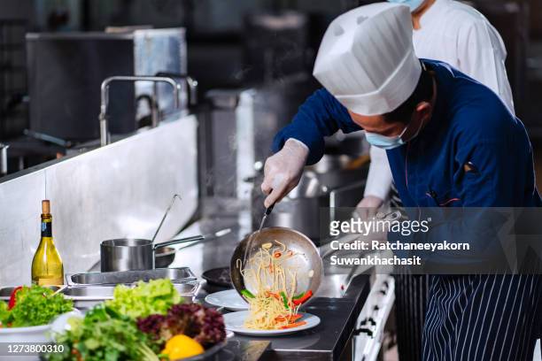 chefs prepare meals modern kitchen. - cooking show stock-fotos und bilder