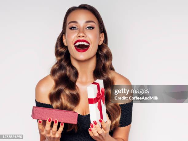 beautiful woman with present - surprise birthday party stock pictures, royalty-free photos & images