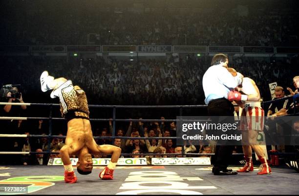 Prince Naseem Hamed of Great Britain somersaults with joy after retaining his WBO and IBF Featherweight titles against compatriot Billy Hardy at the...