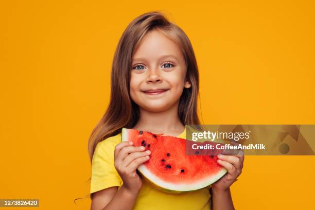 young little girl eating watermelon - kids eating imagens e fotografias de stock
