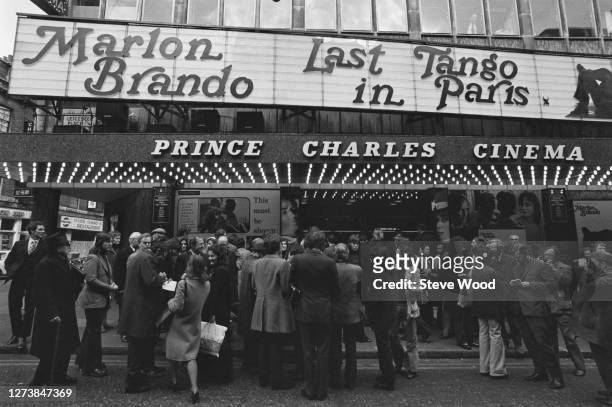 Crowds of cinemagoers beneath the marquee advertising 'Last Tango in Paris' at the Prince Charles Cinema in Leicester Place, London, England, March...