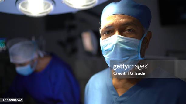 portrait of a male healthcare worker at operating room in hospital - anaesthetist stock pictures, royalty-free photos & images