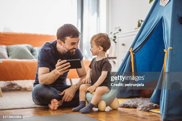 fathers day - potty training stock pictures, royalty-free photos & images