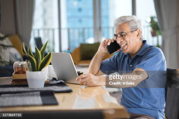 senior man working from home - india phone professional stock pictures, royalty-free photos & images