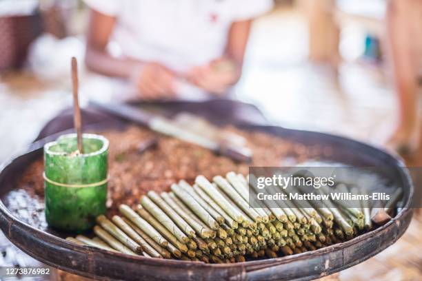 rolling hand made cheroot cigars, a traditional burmese cigar, inle lake, shan state, myanmar, burma - cheroot making stock pictures, royalty-free photos & images