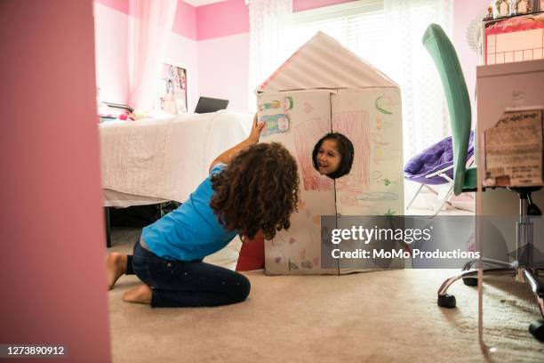 young girls playing with homemade rocket ship - rocket scientist stock pictures, royalty-free photos & images