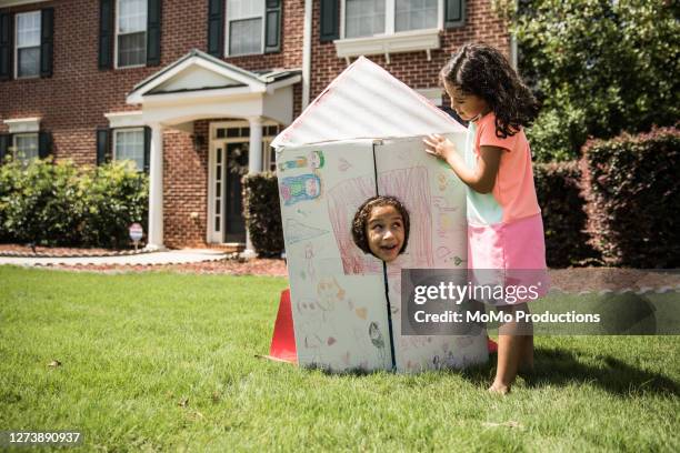 young girls playing with homemade rocket ship - rocket scientist stock pictures, royalty-free photos & images