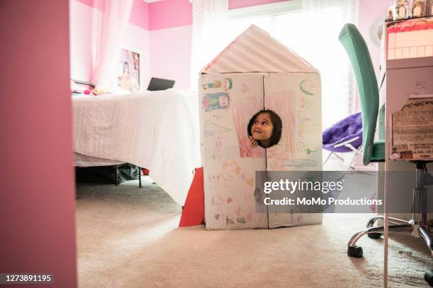 young girl playing with homemade rocket ship - toy rocket stock pictures, royalty-free photos & images